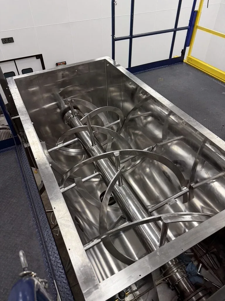 Powder blending and capsule filling station at Eagle Works supplement manufacturing facility in Logan Utah